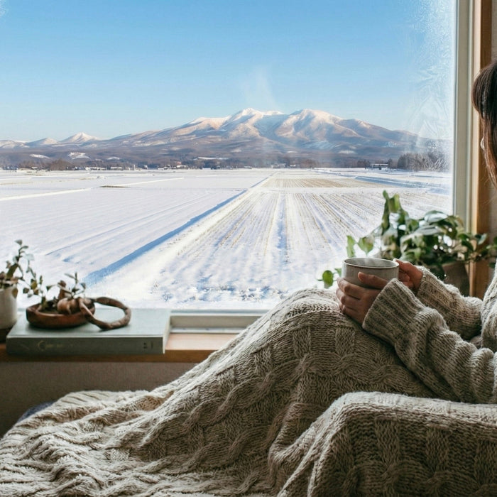 Snowy winter view with coffee cup from window